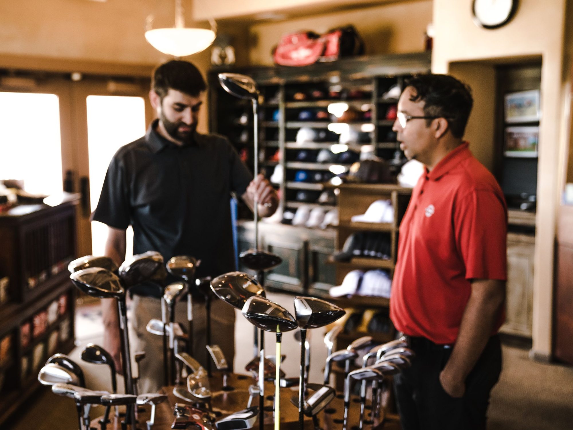 New driver being rung up at the pro shop register